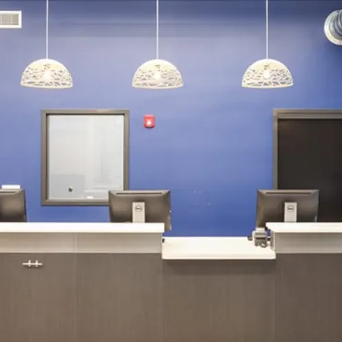Reception desk and blue wall at Carriage Animal Hospital